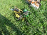 Pile of JD chainsaws