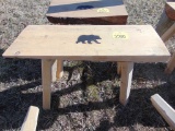 Wood bench with bear
