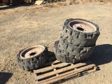 Pallet of (4) Solid Tire Rims, Fits Skid Steers.