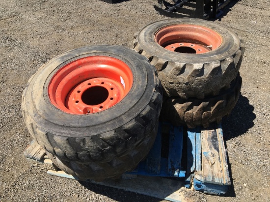 (4) Misc 10-16.5NHS Skid Steer Tires & Rims.