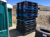 Stack of Plastic Pallets.