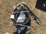 Bundle of Unused Hydraulic Hoses.