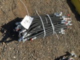 Bundle of Unused Hydraulic Hoses.