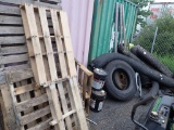 Large Wall Lot of Fencing, Tires, and Pallets