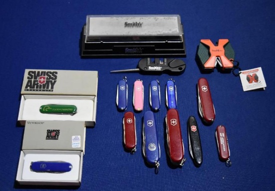 Swiss Army knife lot- 12 pocket knives and 3 sharpening items