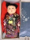 Two Japanese Oriental dolls