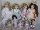 Nineteen modern porcelain dolls to 43cm