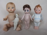 Four antique to modern dolls