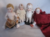 Four cabinet All-bisque dolls with painted
