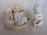 Two bisque figurines. Gorgeous seated baby