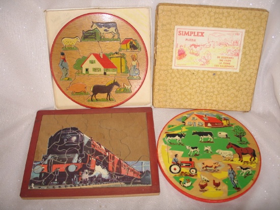 Three child 1950-60s wood puzzles:- Boxed Holland Simplex 19cm round The Fa