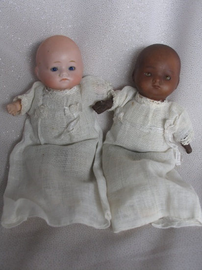 Pair of bisque 'Newborns' 16cm swivel heads. Herm Steiner and brown incised