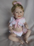 All-porcelain Ashton Drake 'Cute As A Button' 31cm seated baby 1993. All or