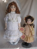 Two porcelain Helen Trihey reproduction 1980 French dolls:- Long face Jumea