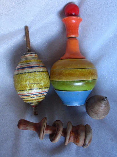 Four vintage wood toys:- Spinning top, rattle, American spinning top c1920-