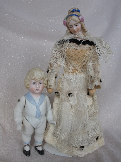 Three vintage dolls:- All bisque Hertwig & Co child 14cm, painted features,