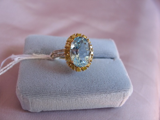 Ladies dress ring 14K yellow Gold, stamped 14K. Oval large 7.8ct sky blue T