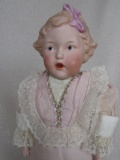 Very rare Gebruder Heubach 7851 'Pink Bow Singing Girl' 14.5” (37cm) c1912.