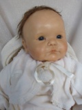 Artist Reborn Baby 53cm. Swivel resin type head with wispy brown mohair wig