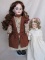 Two Armand Marseille bisque dolls:- Cabinet 24cm AM390, blue glass s-eyes,