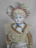 Two antique German cabinet dolls:- Bonnet head 31cm. Molded wide bonnet has