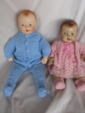 Two weary 1940s composition dolls:- Boy 51cm with lifting paint around the