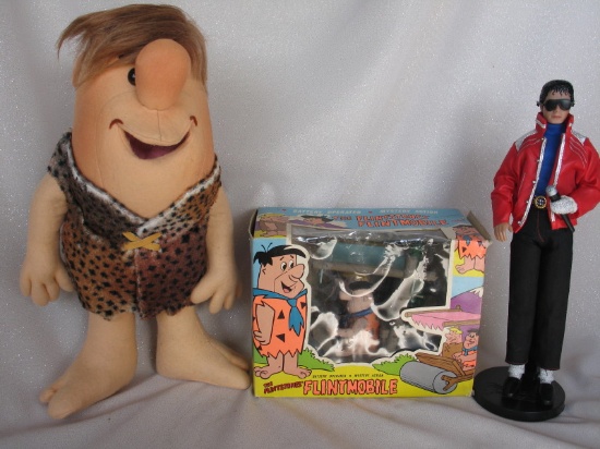 Two Cartoon Flintstone Toys:- AHI boxed 1974 'Flintmobile' battery operated