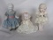 Three antique cabinet dolls:- Blonde Frozen Charolette 14cm gray silk dress