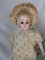 German 1900s F.M. Schilling 34cm composition shoulder head. Brown glass sle