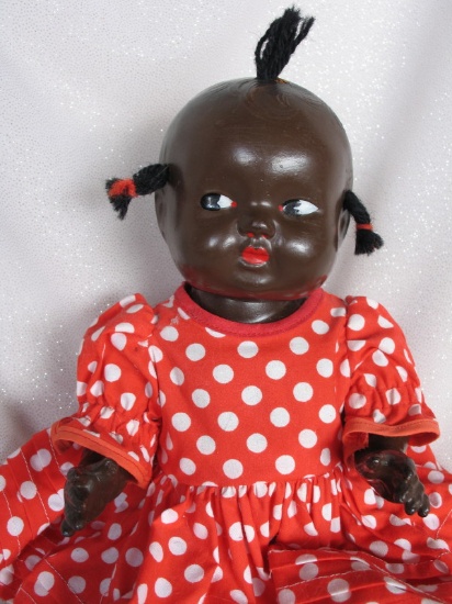 Composition brown Topsy baby c1930s 11" (28cm). Painted side glancing eyes,