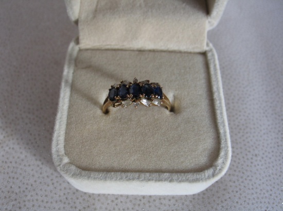 Ladies Estate 18K Gold dress ring stamped 18K. Five central sapphires, 9 di