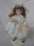 Two German All-bisque dolls 11.5cm. Inserted brown glass eyes, closed mouth