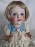 Bisque Nippon 101 baby 26cm. Blue glass sleep eyes, angled lashes, feathere