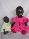 Two Dark Brown OK Kader babies, 35cm missing teeth and tongue in pink knit.