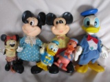Twenty-five plus mostly Walt Disney character vintage toys. Include Mickey/
