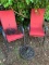 TWO RED PATIO CHAIRS, A METAL UMBRELLA STAND AND METAL BASKETS