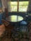 GLASS TOP ROUND WOOD TABLE AND FOUR MISMATCHED CHAIRS