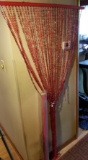 PAIR OF RED BEADED CURTAINS