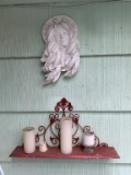 SHELF WITH CANDLES AND FACE WALL HANGING