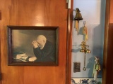 WALL MOUNTED BELLS AND PAINTING OF MAN PRAYING