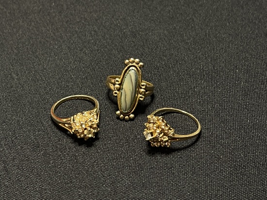 THREE GOLD TONE RINGS