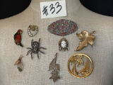 NINE BROOCHES