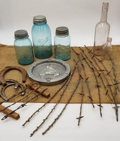 ANTIQUE JARS, BOTTLES, BARBWIRE, HORSESHOES, AND ASHTRAY