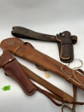 TWO HOLSTERS AND A RIFLE SCABBARD