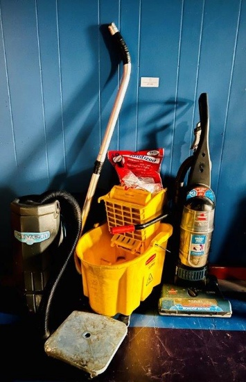 TWO VACUUMS AND A MOP BUCKET