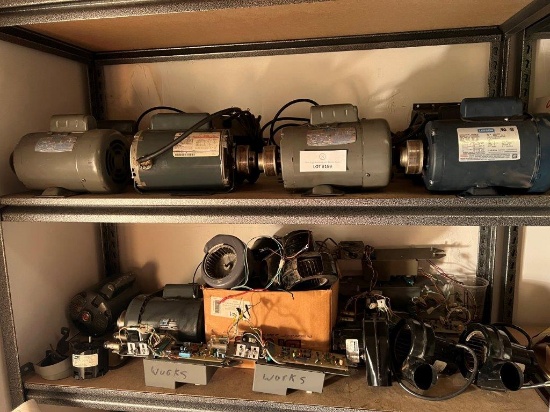 TWO SHELVES FILLED WITH MOTORS