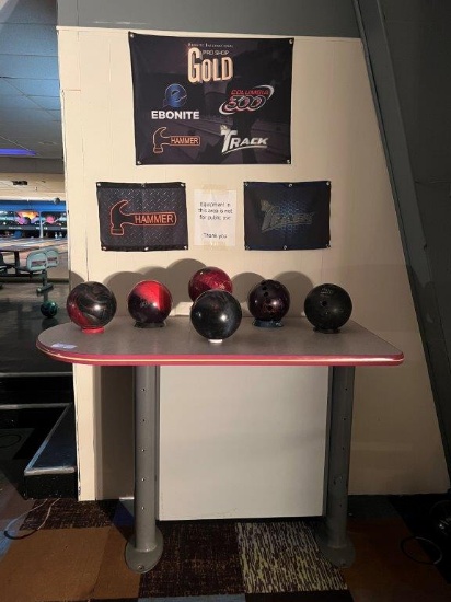 BRUNSWICK BOWLING ALLEY TABLE WITH SIX DISPLAY BOWLING BALLS, AND WALL ADVERTISEMENTS