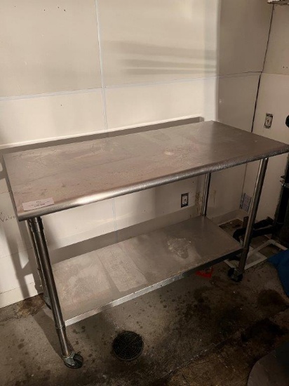 STAINLESS STEEL TABLE ON WHEELS