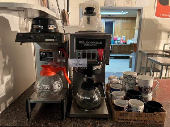 TWO COFFEE MAKERS AND COFFEE MUGS