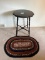 Dark Stain Side Table with Turned Spindle Legs, and an Oval Area Rug